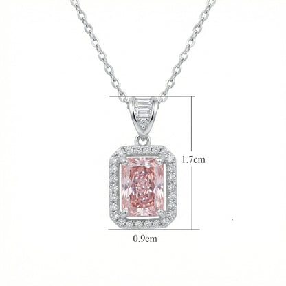 The Sakura Hanagasumi Pendant, front view, radiant-cut pink gemstone in a halo setting