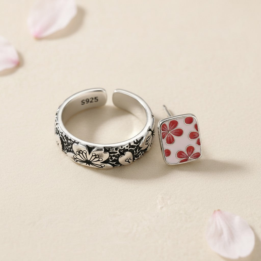 The Hanami Set — macro detail of the engraved silver ring and enamel cherry blossom earrings