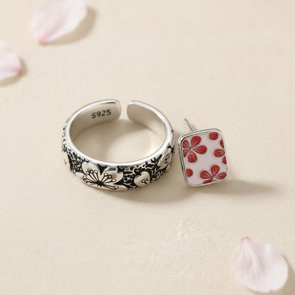 The Hanami Set — macro detail of the engraved silver ring and enamel cherry blossom earrings