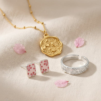 The Kanzashi Trio — three-quarter angle of the pendant, earrings and ring
